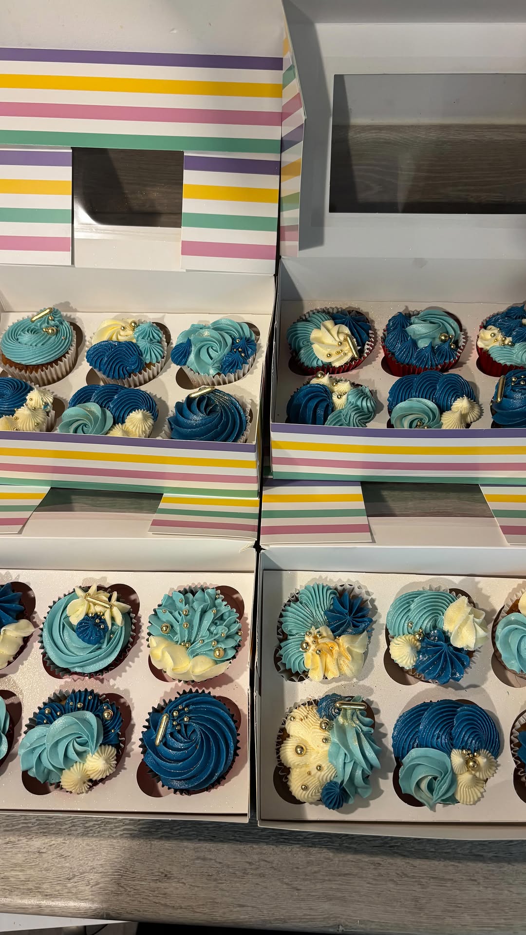 Cupcakes being hand-decorated in the Cakes by Leila kitchen