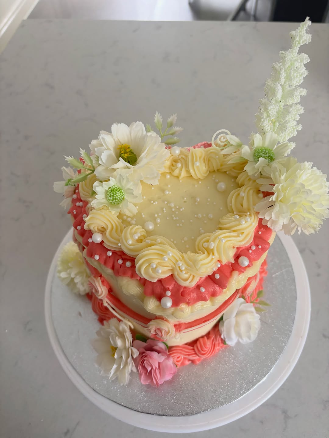 Close detail of piped buttercream and sugar pearls — Cakes by Leila