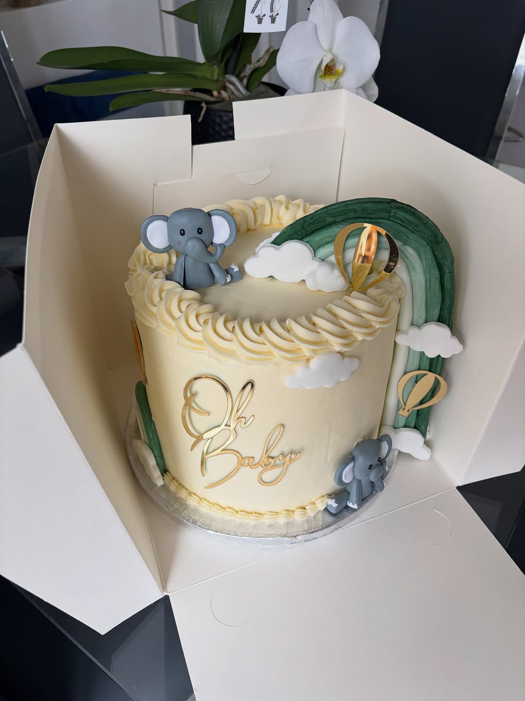 Pastel baby shower cake with elephant and rainbow detailing by Cakes by Leila